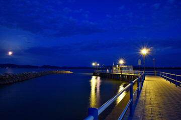 Fototapeta na wymiar Molo in notturna, Castiglion del Lago