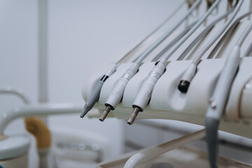 Close-up capture of meticulously arranged dental instruments, showcasing the precision and...