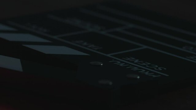 Video of clapperboard on a table in a local film production. Concept of film and video industry.