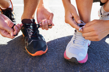 Shoes, hands and people tie laces for run, closeup for fitness and cardio outdoor, athlete team and...