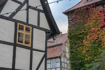 Historic half-timbered house and gable with autumn leaves in Quedlinburg, Saxony-Anhalt, Germany