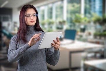 Fototapeta premium Smiling happy business woman using digital tablet