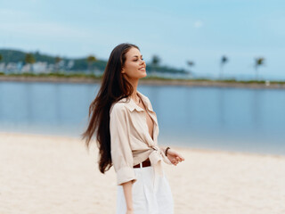 Joyful Summer Getaway: Beautiful Young Woman Walking Alone on a White Sandy Beach, Enjoying the Warmth of the Sun and Cool Breeze of the Azure Ocean