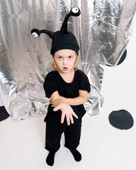 little girl in a black monster costume