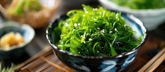 Poster Im Rahmen Bowl of seaweed salad from Japan. © AkuAku