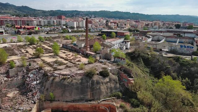 Drone approach to old chimney in abandoned textile factory, Olesa de Montserrat