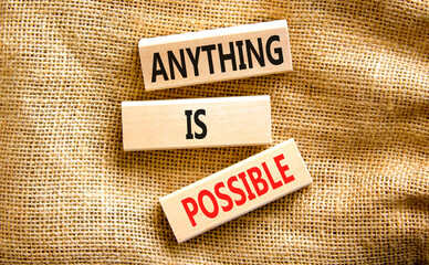 Anything is possible symbol. Concept words Anything is possible on beautiful wooden blocks....