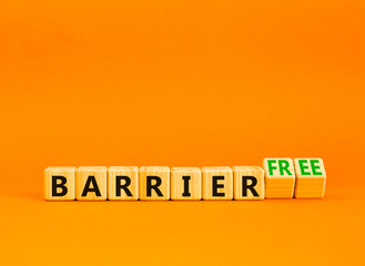 Barrier free symbol. Concept words Barrier free on beautiful wooden cubes. Beautiful orange table orange background. Business, inclusivity and barrier free concept. Copy space.