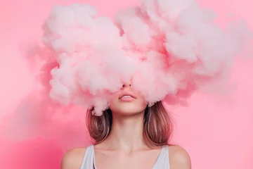 Fotobehang a young woman with her head in pink cloud on a pastel pink background © Александр Марченко