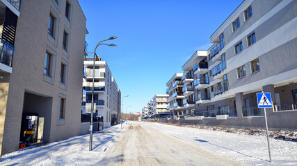 Residential area with modern, new and stylish living blocks of flats in winter time.  © Grand Warszawski