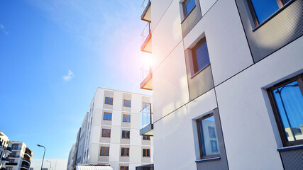 Modern apartment building in sunny day. Exterior, residential house facade. Residential area with modern, new and stylish living block of flats. 