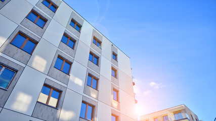 Modern apartment building in sunny day. Exterior, residential house facade. Residential area with modern, new and stylish living block of flats. 