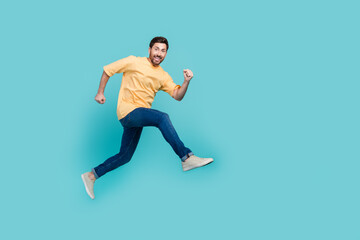 Fototapeta na wymiar Full body size photo of funky positive man in air jumping ambitious running sportsman practicing isolated on aquamarine color background