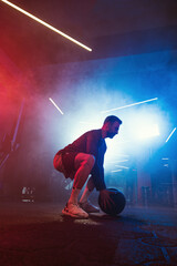 Medicine Ball Slam in Vibrant Gym Ambiance