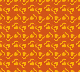 Retro 70's love heart seamless vector pattern. Yellow, orange heart shapes background. Funky, groovy seventies style design. Repeat backdrop wallpaper texture print.
