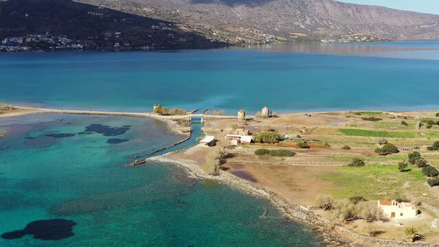 The famous canal of Elounda with the ruins of the old bridge, Crete, Greece.