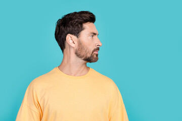 Fototapeta premium Side photo of boyfriend young guy brunet hair unshaven with bristle after barber shop hairdresser isolated over blue color background