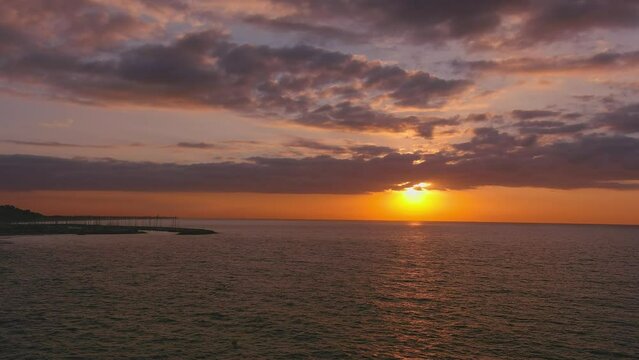 Dawn on Garraf horizon, with Ginesta port in background, Catalonia