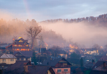 Landscape with fog over the village houses in the early morning