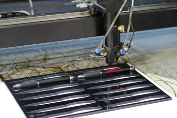 Laser engraving machine printing on pens