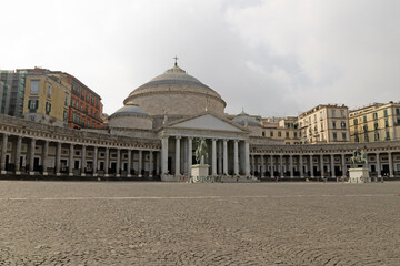 Cityscape image of Naples, Italy with the view of large public town square Piazza del Plebiscito.