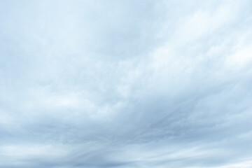 Dense gray thunderstorm cumulus wavy clouds in the whole frame. Gloomy rainy Sky background for superimposing on your photos