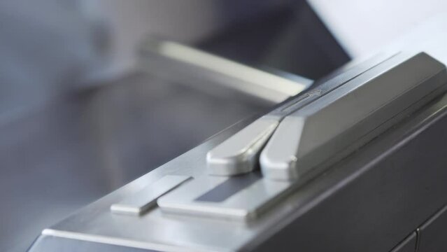 Swiping subway ticket card through reader in station 4k