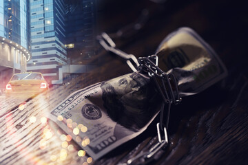 The American currency is dollars, tied with a chain. double exposure business city