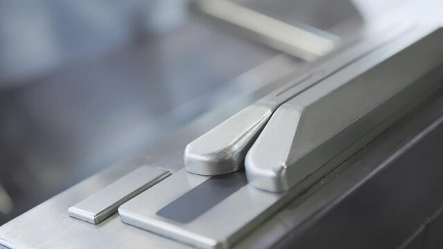 Swiping subway ticket card through reader in station 4k