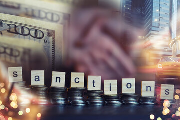 Economic sanctions against Russia because of Ukraine. Stacked coins on table. Multiple exposure...