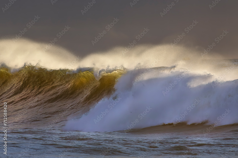 Sticker Spraying breaking waves at sunset