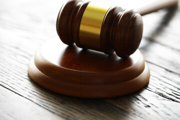 Judges gavel on wooden desk. Law firm concept.