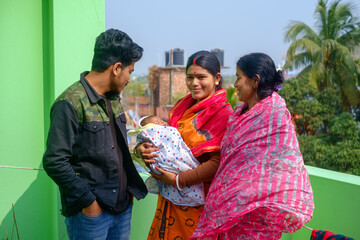 Happy moments of a south asian family with newborn baby girl 