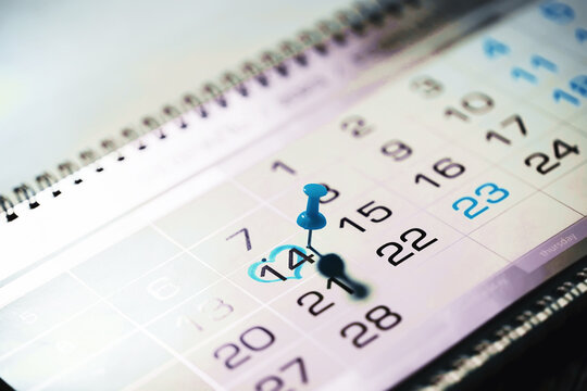 Calendar with circled date february 14. Blue heart shape. Blue flag. Valentines day.