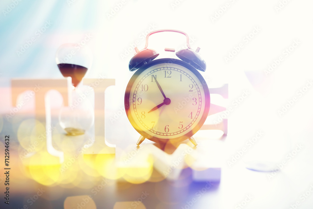 Wall mural Background with a clock on the table and bokeh in pastel rainbow colors. Time for rest and travel.