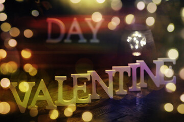 The word "Valentine's Day". Love on wooden blocks. Theme of love. Wooden letter blocks. Loving, positive emotions. Wooden letters with the word. An exclusive relationship.