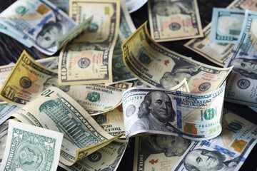 Money, US dollar bills background. Money scattered on the desk. Photography for Finance and Economy...