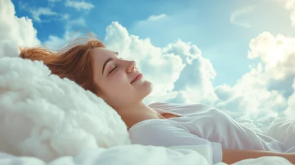 Foto op Canvas Beautiful young woman with a smile sleeps on a bed with a soft white dazzling blanket and pillows that float in the clouds against the background of a blue bright sky © Mars0hod