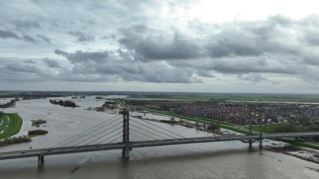 Aerial view over the Molenbrug over the river Ijssel with flooded floodplains during winter in Overijssel, Netherlands