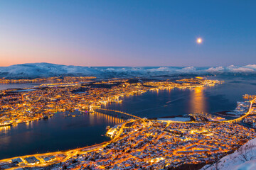 Norway- Troms og Finnmark- Tromso- long exposure of illuminated city seen from Fjellheisen at sunset
