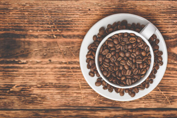 Cup full of roasted coffee beans