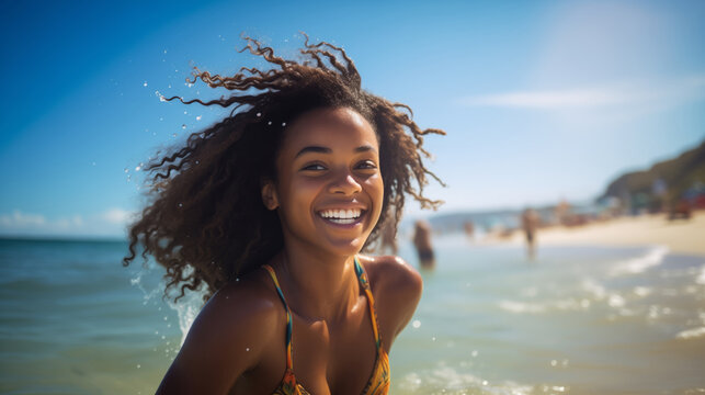 An african american teenage girl happily enjoying herself on a sunny beach during a warm day. girl on the beach in the summer. travelling alone concept, happy moment. 