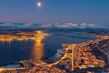 Norway- Troms og Finnmark- Tromso- long exposure of illuminated city seen from Fjellheisen at sunset