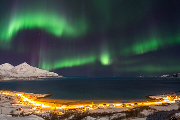 Aurora borealis or Northern lights in the sky over Tromso - Norway