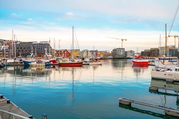 Fotobehang View of a marina and harbor in Tromso, North Norway. Tromso is considered the northernmost city in the world with a population above 50,000 © johnkruger1