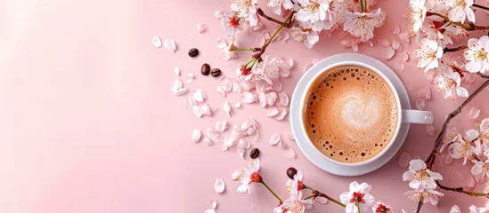 Fotobehang Coffee with cappuccino, milk chocolate, cherry blossoms, caffeine boosts brain, stimulates nerves, health effects, empty area, banner. © AkuAku