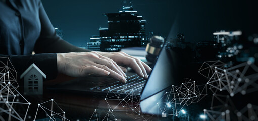 Lawyer or real estate agent working on a laptop.