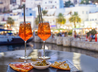 aperol spritz aperitif with appetizers in a Mediterranean setting