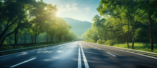 Empty asphalt road and blurred speed movement on highway in rural forest - obrazy, fototapety, plakaty