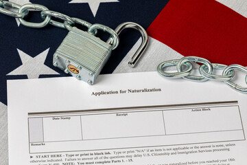 United States citizenship and naturalization visa application with flag and unlocked chain. Border...